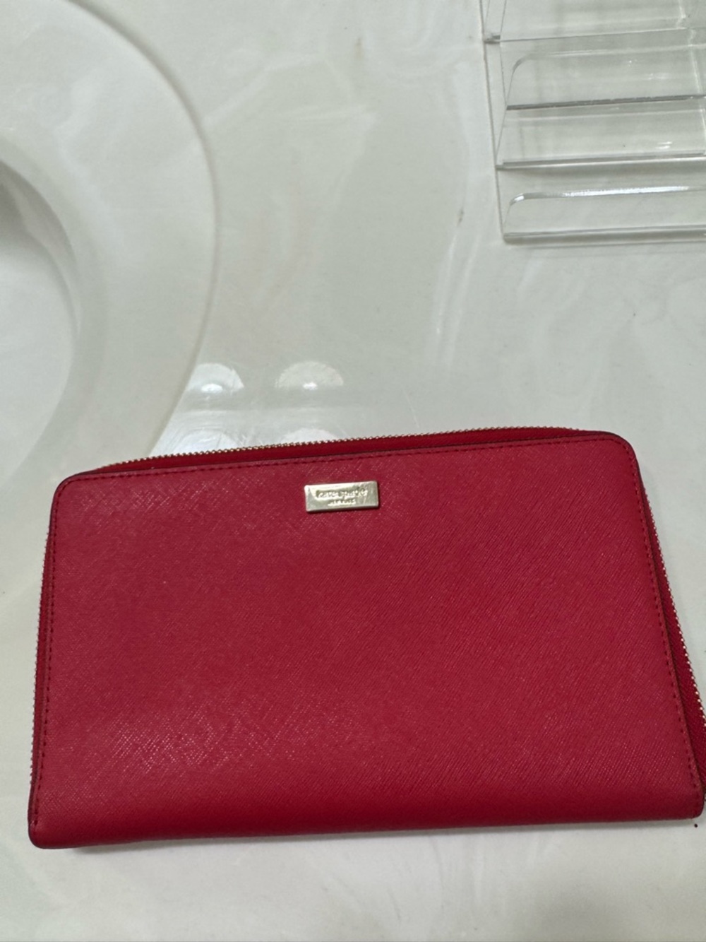 Kate spade long red zip-around leather wallet with gold logo plaque